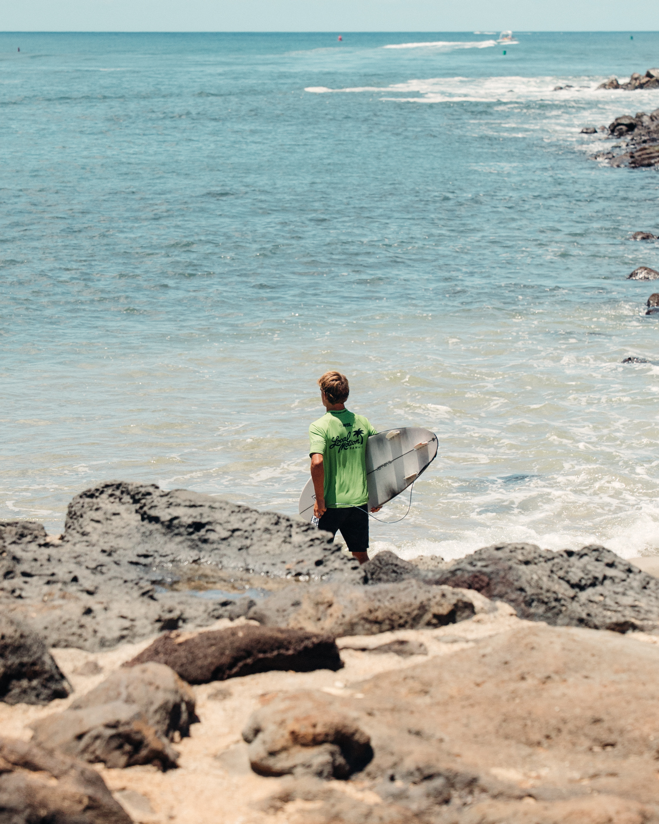Ezra Clark suiting up beside the shoreline