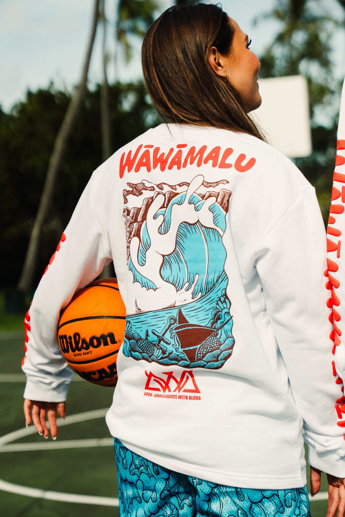 Wāwāmalu artwork on the back of the AVVA × Aaron Kai crewneck