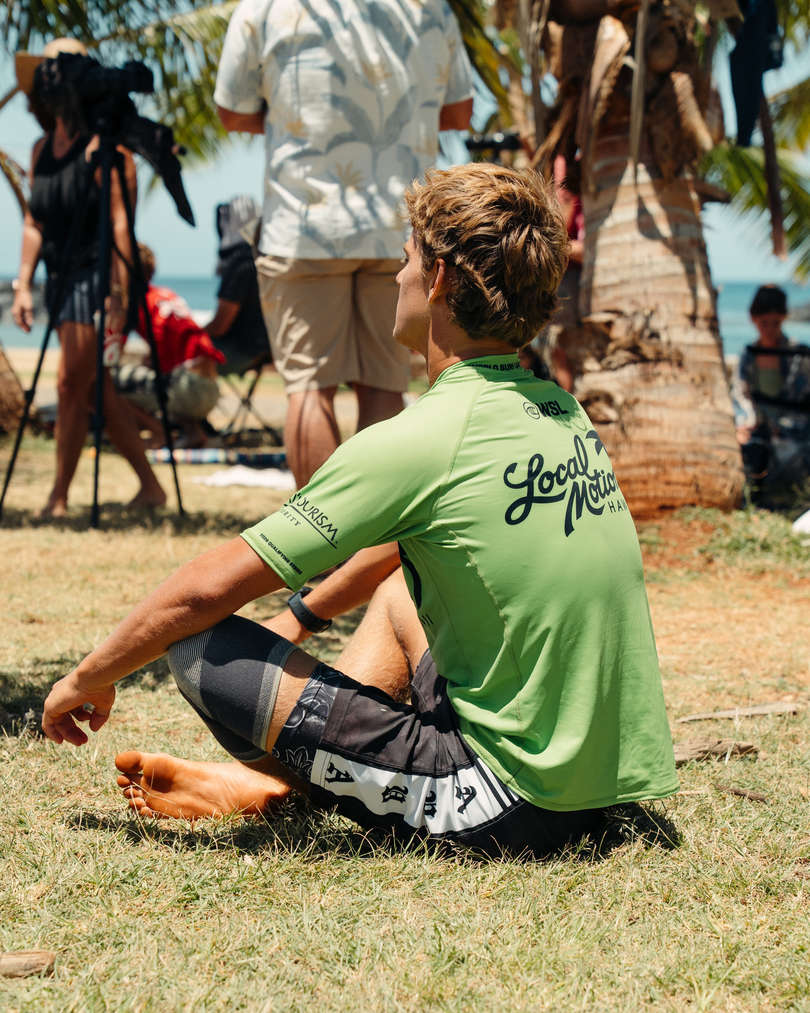 Ezra Clark posted up with the Honolulu skyline behind him