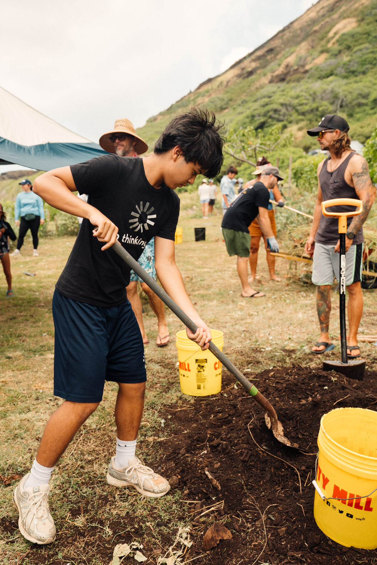 Spreading compost to support native plants