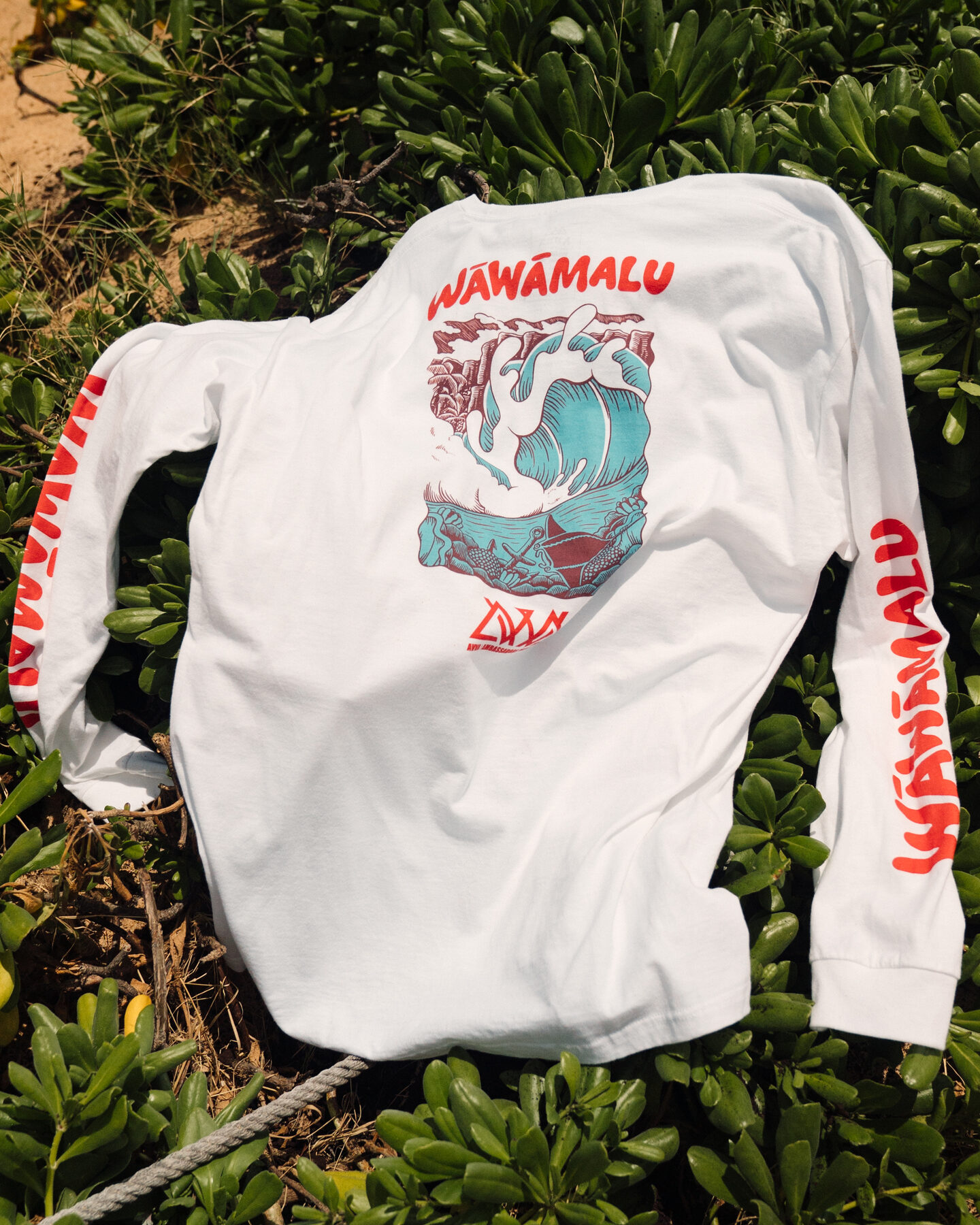 Wāwāmalu tee back graphic flat lay