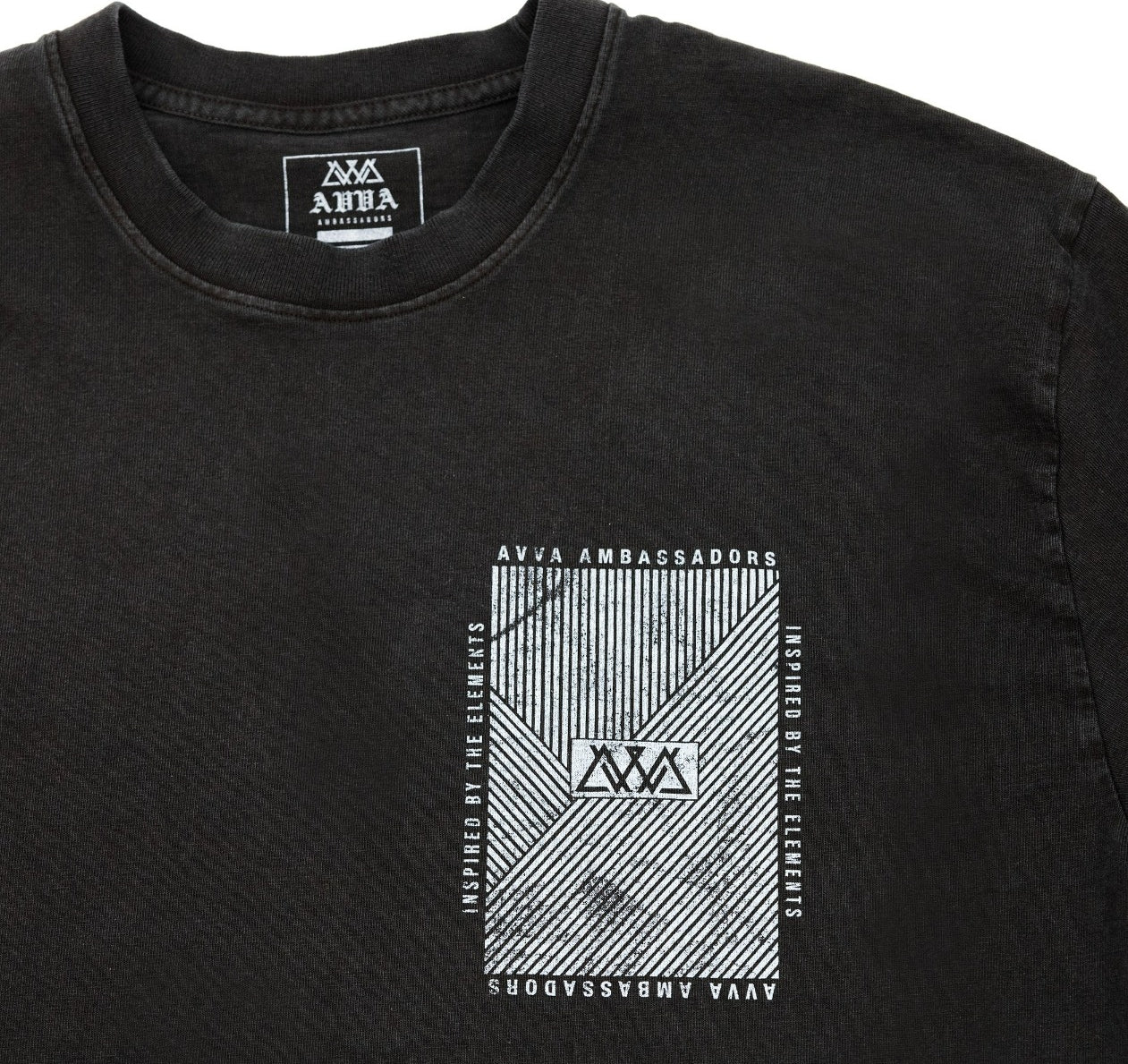 FRONT CLOSE UP VIEW OF HEAVYWEIGHT CLIMATE LONG SLEEVE. HIGHLIGHTING AVVA AMBASSADORS INSPIRED BY THE ELEMENTS LOGO IN TOP RIGHT.
