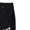 CLOSE UP VIEW OF BLACK SAND BOARDSHORT SIDE POCKET WITH ZIPPER DOWN. HIGHLIGHTING INVISIBLE ZIPPER PLACED ON SIDE SEAM.