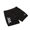 ANGLED FRONT VIEW OF BLACK SAND BOARDSHORTS. INVISIBLE ZIPPER ON ONE SIDE, STANDARD WAISTBAND WITH DRAWSTRINGS. AVVA LOGO SCREEN PRINT AND LOGO PATCH ON OTHER LEG.