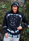 FRONT VIEW OF MODEL WEARING GAGE HOODIE WITH GREENERY IN BACKGROUND