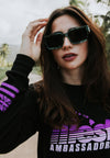 FRONT CLOSE UP VIEW OF MODEL WEARING ILLEST AMBASSADOR BLACK LONG SLEEVE TEE