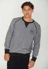 FRONT VIEW OF MODEL SHOWING THE INSIDE OF THE MADISON REVERSIBLE BLACK CREW