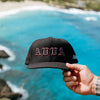 FRONT PRODUCT IMAGE OF WAIMEA HAT WITH OCEAN BACKGROUND